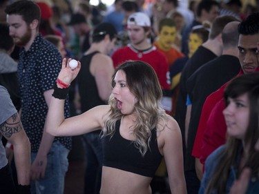 Amanda Behrens gets ready to send a ball to a red cup as she takes part in the beer pong tournament Saturday.