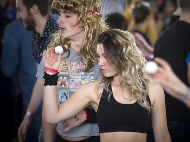 Amanda Behrens gets ready to send a ball to a red cup as she takes part in the beer pong tournament Saturday.