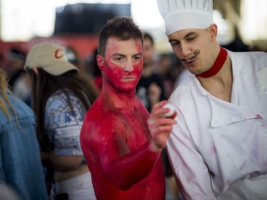 Mathieu Gignac was concentrating very hard while covered in red paint as chef Alex Chevrette looked on.