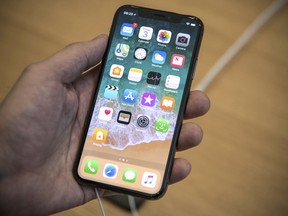 The iPhone X had a bright, edge-to-edge display and 3-D facial recognition, but the US$999 starting price was too much for some consumers.