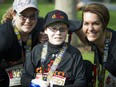 Jonathan Pitre poses with his sister, Noemy Pitre, and mother Tina Boileau after finishing the 5K race during Tamarack Ottawa Race Weekend in May 2016.