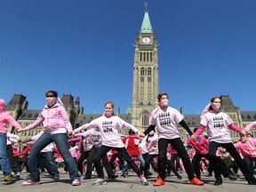 In this April 2014 file photo,  120 kids from Michaelle-Jean Public School, from grade three to six,  danced a routine in front of Parliament Hill Wednesday for Pink Day.