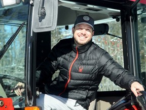 Erik Bédard goofs around on a snowplow at his home in Cumberland.  Julie Oliver/Postmedia