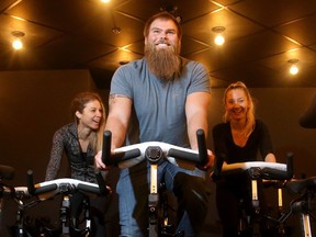 Redblacks offensive lineman Jon Gott and his girlfriend Nicole Hilstob (left, along with employee Meagan Foster, right) have a new fitness studio called SPINCO in downtown Ottawa.