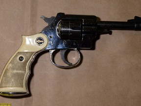 Loaded handgun that was found under the front seat of a car stolen during a robbery and kidnapping in Kingston.