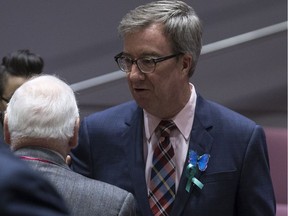 Ottawa Mayor Jim Watson wears a butterfly in honour of Jonathan Pitre.