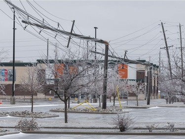 Hydro poles snapped in half at the Ottawa Train Yards shopping area in during a severe spring storm. April 16,2018. Errol McGihon/Postmedia