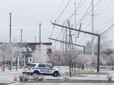 Hydro poles snapped in half at the Ottawa Train Yards shopping area in during a severe spring storm. April 16,2018.