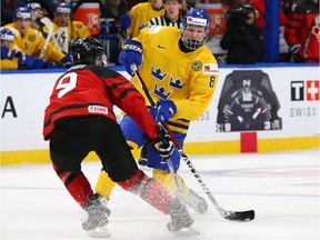 Rasmus Dahlin of Sweden, right, is acknowledged as the top prospect for the 2018 draft. The Senators hold a 13.5 per cent chance of winning the first pick in the draft lottery on April 28.
