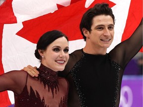 GANGNEUNG, SOUTH KOREA - FEBRUARY 20:  Gold medal winners Tessa Virtue and Scott Moir of Canada celebrate during the victory ceremony for the Figure Skating Ice Dance Free Dance on day eleven of the PyeongChang 2018 Winter Olympic Games at Gangneung Ice Arena on February 20, 2018 in Gangneung, South Korea.