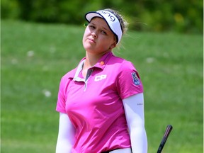 Brooke Henderson of Smiths Falls reacts to her shot out of the bunker on the fourth hole during the third round of play on Friday.