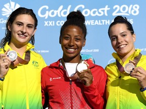 GOLD COAST, AUSTRALIA - APRIL 14:  (L-R) Silver medalist Maddison Keeney of Australia, gold medalist Jennifer Abel of Canada and bronze medalist Anabelle Smith of Australia pose during the medal ceremony for the Women's 3m Springboard Diving Final on day 10 of the Gold Coast 2018 Commonwealth Games.