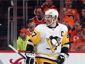 PHILADELPHIA, PA - APRIL 15: Sidney Crosby #87 of the Pittsburgh Penguins celebrates a second period goal by Evgeni Malkin #71 (not shown) against the Philadelphia Flyers in Game Three of the Eastern Conference First Round during the 2018 NHL Stanley Cup Playoffs at the Wells Fargo Center on April 15, 2018 in Philadelphia, Pennsylvania.