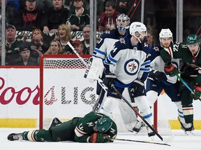 ST PAUL, MN - APRIL 17: Eric Staal #12 of the Minnesota Wild lays on the ice after a check by the Winnipeg Jets during the first period in Game Four of the Western Conference First Round during the 2018 NHL Stanley Cup Playoffs at Xcel Energy Center on April 17, 2018 in St Paul, Minnesota.