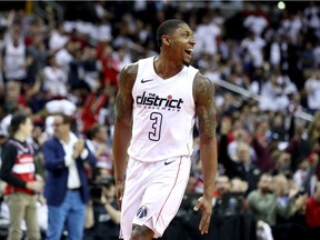 Bradley Beal #3 of the Washington Wizards celebrates after hitting a three pointer against the Toronto Raptors in the first half during Game Three of Round One of the 2018 NBA Playoffs at Capital One Arena on April 20, 2018 in Washington, DC.