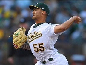 Sean Manaea #55 of the Oakland Athletics pitches against the Boston Red Sox in the top of the first inning at the Oakland Alameda Coliseum on April 21, 2018 in Oakland, California.