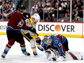 Patrik Nemeth #12 and goalie Andrew Hammond #35 of the Colorado Avalanche prevent a shot on goal by Viktor Arvidsson #33 of the Nashville Predators in Game Six of the Western Conference First Round during the 2018 NHL Stanley Cup Playoffs at the Pepsi Center on April 22, 2018 in Denver, Colorado.