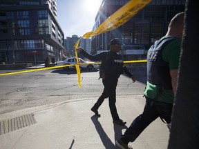 Police enter the scene on Yonge St. at near Finch Ave., after a van plowed into pedestrians on April 23, 2018 in Toronto, Canada. A suspect identified as Alek Minassian, 25, is in custody after a driver in a white rental van collided with multiple pedestrians killing nine and injuring at least 16.