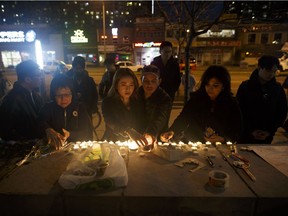 TORONTO, ON - APRIL 23: People lay candles and leave messages at a memorial for victims of a crash on Yonge St. at Finch Ave., after a van plowed into pedestrians on April 23, 2018 in Toronto, Canada. A suspect identified as Alek Minassian, 25, is in custody after a driver in a white rental van collided with multiple pedestrians killing nine and injuring at least 16.