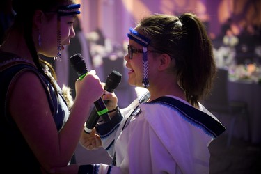 Throat singers with the name "Tarniriik," which means two souls, include 13-year-old Cailyn Degrandpre (left) and 14-year-old Samantha Kigutaq-Metcalfe (right).