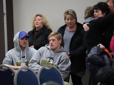 People attend a press conference at the Humboldt Uniplex on April 7, 2018 in Humboldt, Saskatchewan after a bus carrying a junior ice hockey team collided with a semi-trailer truck.