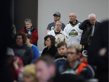 People attend a press conference at the Humboldt Uniplex on April 7, 2018 in Humboldt, Saskatchewan after a bus carrying a junior ice hockey team collided with a semi-trailer truck.