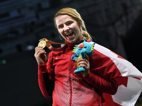 Canada's gold medallist Erica Wiebe poses for photo during the medal ceremony of the women's freestyle 76 kg  wrestling event at the 2018 Gold Coast Commonwealth Games in the Carrara Sports Arena on the Gold Coast on April 12, 2018.