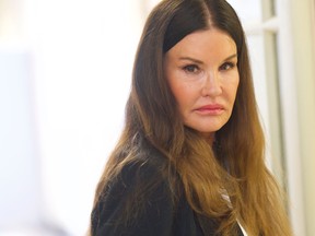 Bill Cosby accuser model Janice Dickinson, 63, walks through the Montgomery County Courthouse after lunch to testify on the fourth day of the sexual assault retrial on April 12, 2018 in Norristown, Pennsylvania.