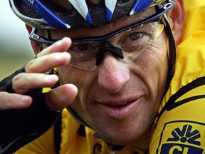 This file picture taken on July 8, 2004 shows US rider Lance Armstrong (US Postal/USA) during the fifth stage of the 91st Tour de France cycling race between Amiens and Chartres. Lance Armstrong has agreed to pay $5 million in order to settle his looming federal fraud case stemming from his use of performance-enhancing drugs during the Tour de France, US media reported on April 19, 2018. The former cycling superstar was due to face a trial next month over claims that he defrauded the US government when he doped while racing for his United States Postal Service-sponsored team.