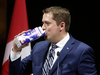 Conservative Leader Andrew Scheer joked that he “made deals with nobody” — before drinking from a carton of milk at the press gallery dinner last June.