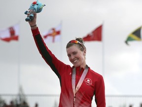 Joanna Brown of Canada celebrates after receiving her bronze medal in the women's triathlon at Southport Broadwater Parklands in the 2018 Commonwealth Games on the Gold Coast, Australia, Thursday, April 5, 2018.