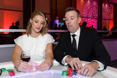 Ottawa's New Country 94 Morning Pickup co-hosts (and event emcees) Sophie Moroz and Jeff Hopper ham it up at a blackjack table.