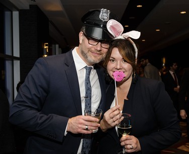Steven Dorey and Mélanie Pronovost have some fun while wearing a police cap and bunny ears.