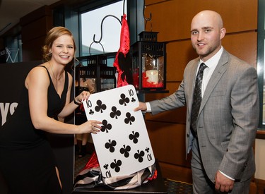 Carissa Rathwell and Dylan Wisotzki pick a card, any card, during the 6th Annual Casino Royale.