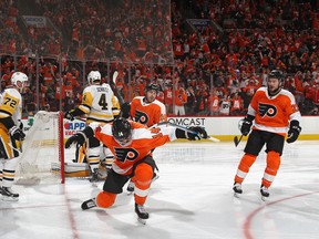 Flyers forward Sean Couturier celebrates one of his three goals against the Pittsburgh Penguins on Sunday in Philadelphia. (Bruce Bennett/Getty Images)