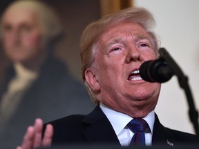 President Donald Trump speaks in the Diplomatic Reception Room of the White House on Friday, April 13, 2018, in Washington, about the United States' military response to Syria's chemical weapon attack on April 7.