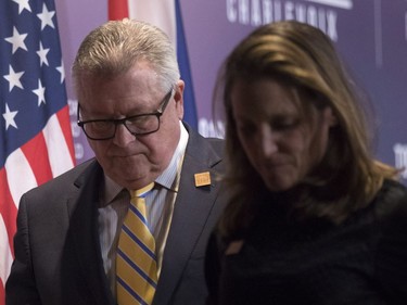 Canada's Minister of Public Safety Ralph Goodale and Canadian Minister of Foreign Affairs Chrystia Freeland step off a stage following a press briefing in Toronto on Monday, April 23, 2018.THE CANADIAN PRESS/Chris Young ORG XMIT: chy116