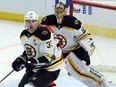 Bruins defenceman Zdeno Chara (33) knocks down the puck in front of goalie Tuukka Rusk during a game against the Senators on Dec. 30.