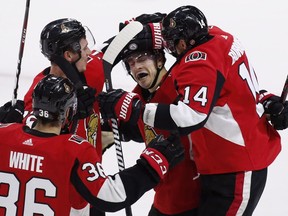 Ottawa Senators centre Jean-Gabriel Pageau (44) celebrates his game-winning goal against the Florida Panthers with centre Colin White (36), defenceman Thomas Chabot (72) and right wing Alexandre Burrows (14) during overtime NHL hockey action in Ottawa on Thursday, March 29, 2017.