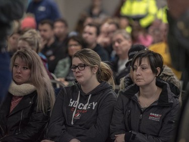 Community members listen during a press conference at the Elgar Petersen Arena in Humboldt, Sask., on Saturday, April 7, 2018.