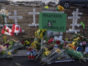 Hockey sticks, messages and other items continue to be added to a memorial at the intersection of a fatal bus crash that killed 16 members of the Humboldt Broncos hockey team.