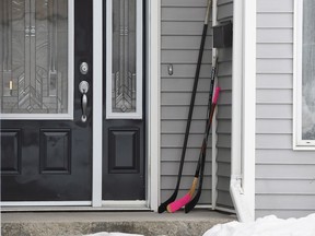 Hockey stick sits on the front porch of a house in Humboldt, Sask., on Monday, April 9, 2018. Social media users are reaching out to the Saskatchewan town of Humboldt, sharing photos of hockey sticks left on front porches to pay tribute to the 15 lives lost after a bus carrying the Broncos junior hockey team collided with a semi truck. Fourteen others were injured in Friday's crash - some critically. The tragedy has captured the world's attention, and more than $5 million had been raised online for the victims and their families by Monday morning.