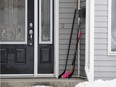 Hockey stick sits on the front porch of a house in Humboldt, Sask., on Monday, April 9, 2018. Social media users are reaching out to the Saskatchewan town of Humboldt, sharing photos of hockey sticks left on front porches to pay tribute to the 15 lives lost after a bus carrying the Broncos junior hockey team collided with a semi truck. Fourteen others were injured in Friday's crash - some critically. The tragedy has captured the world's attention, and more than $5 million had been raised online for the victims and their families by Monday morning.