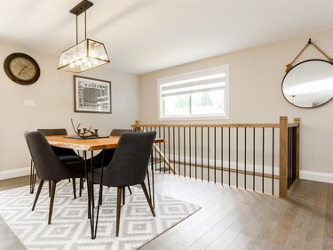 One of the biggest changes to the main floor of the bungalow was the staircase, which was moved from the center of the space to the corner of the home in order to open the area.