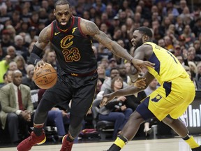 Cleveland Cavaliers' LeBron James, left, drives past Indiana Pacers' Lance Stephenson in the first half of Game 7 of an NBA basketball first-round playoff series, Sunday, April 29, 2018, in Cleveland. (AP Photo/Tony Dejak)