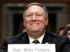 Secretary of State-designate Mike Pompeo smiles after his introduction before the Senate Foreign Relations Committee during a confirmation, April 12, 2018.
