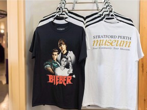 Fan shirts for Justin Bieber are for sale at the Stratford Perth Museum for the Steps to Stardom exhibition about Justin Bieber in Stratford Ont. on Saturday, Feb.17, 2018. Justin Bieber has made an unexpected visit to an exhibit on himself in his hometown of Stratford, Ont.