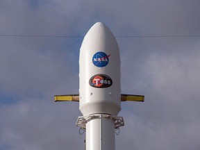 This photo released by SpaceX on Wednesday, April 18, 2018 shows a Falcon 9 rocket carrying NASA's Transiting Exoplanet Survey Satellite at Cape Canaveral Air Force Station in Fla. Once in orbit, TESS will peer at hundreds of thousands of bright neighboring stars, seeking planets that might support life. (SpaceX via AP)