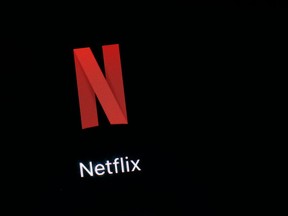 FILE- This March 19, 2018, file photo shows the Netflix app on an iPad in Baltimore. Netflix, Inc. reports earnings Monday, April 16, 2018.