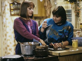 In this image released by ABC, Laurie Metcalf, left, and Roseanne Barr appear in an episode of the comedy series "Roseanne," that originally aired on Oct. 31, 1989. The popular series returned to primetime television with impressive ratings in the first two weeks. (ABC via AP)